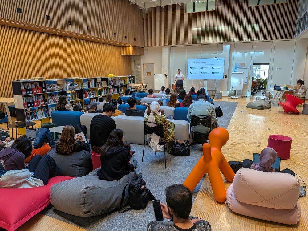 Students seated on sofas and beanbags at a Creatives of Tomorrow university talk