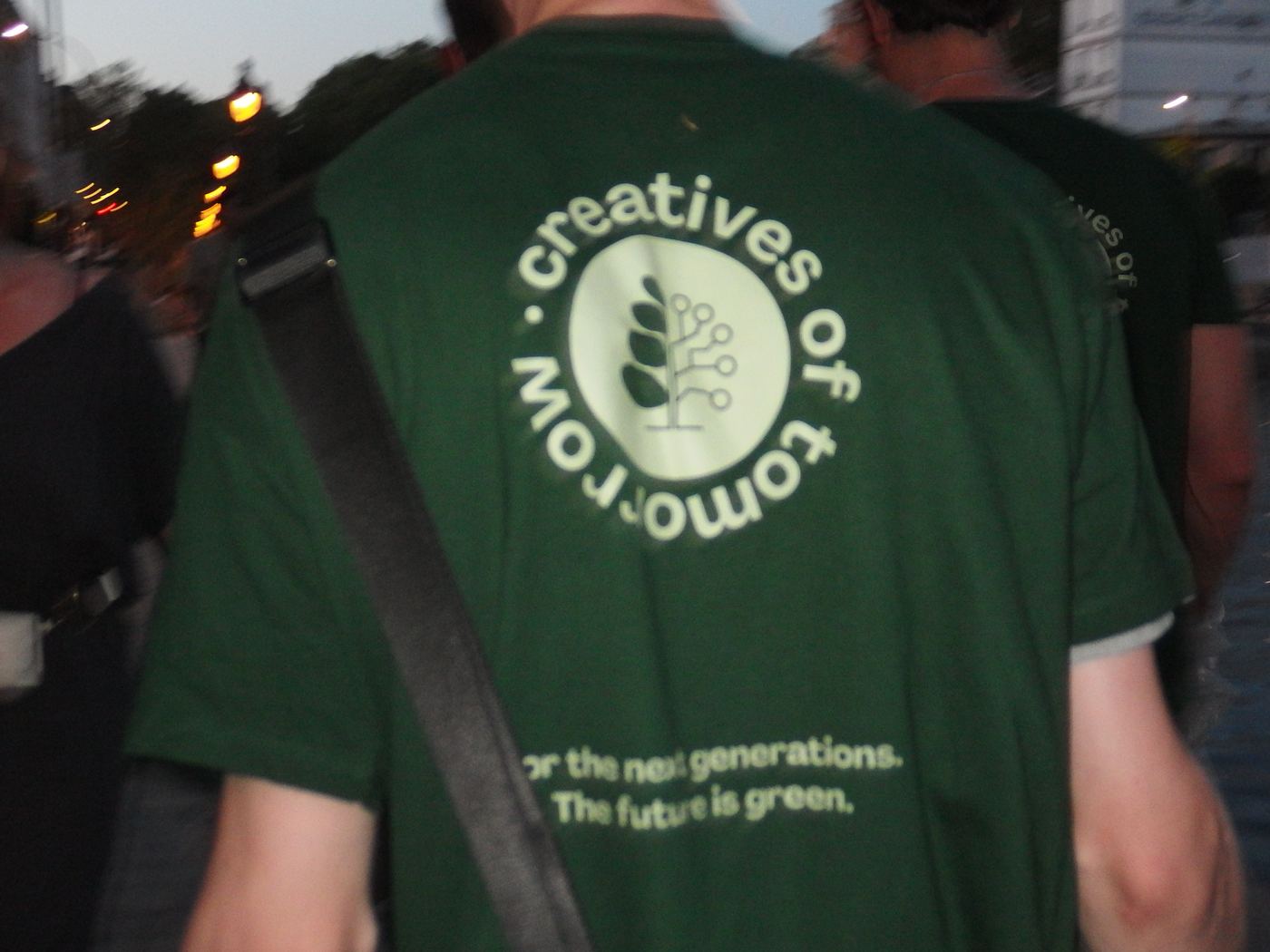 Close-up of a Creatives of Tomorrow t-shirt reading 'for the next generations, the future is green'